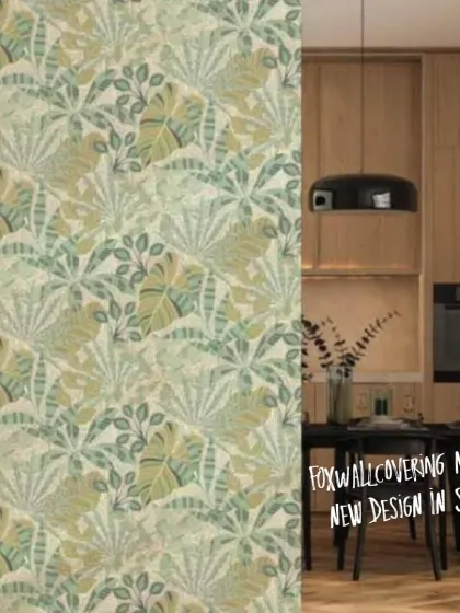 This image shows the light green tropical leaf wallpaper in a modern kitchen and dining area, demonstrating its versatility in different settings.