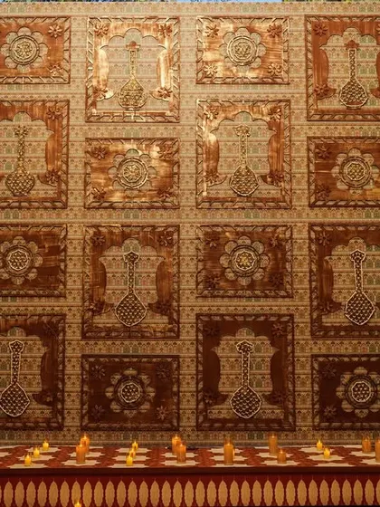 A view of the ceiling of the mandap, where we created a stunning pattern with hand-pasted orange chrysanthemums and mogra jaali work.
