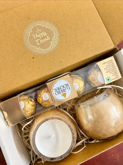 The same Diwali hamper, but with a white candle. I can customize the candle color and scent to your preference.