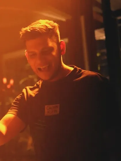A candid shot of me smiling and enjoying the set. When the DJ is having fun, the crowd has fun too.