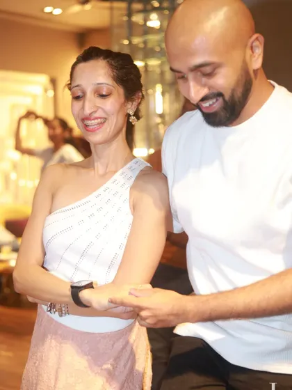 A close-up of a happy couple dancing, their smiles reflecting the fun and connection they're experiencing.
