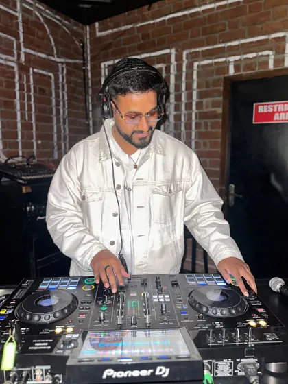 Focused on the mix at a gig in Hyderabad. This shows my concentration and dedication to delivering a perfect set, no matter the city.