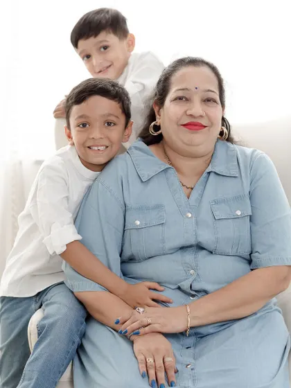 A loving portrait of two grandsons with their grandmother, a precious multi-generational memory.