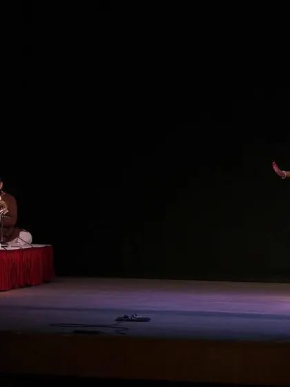 A solo moment during our group's 'Nrithyotsavam' performance. Even within an ensemble piece, there are opportunities for individual expression, all while being supported by the live orchestra and fellow dancers.