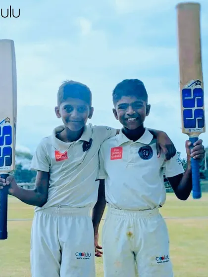 Two young teammates and friends, proud after a good day on the cricket field. Our camps are where lasting friendships are built.