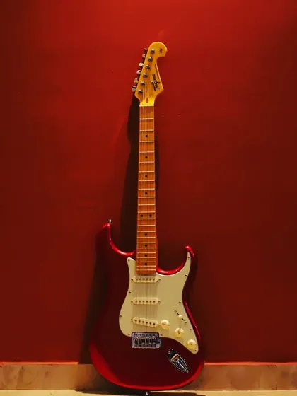 "If you want music to be your livelihood, then play, play, play and play." This beautiful red electric guitar is waiting to be played.