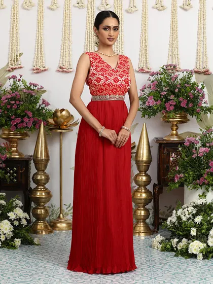 The full view of the red Bandhani dress, a perfect choice for a bride's mehendi or a festive gathering.