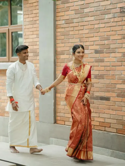 A sweet, candid moment between the bride and groom. Hema and Karthik share a walk and a smile at their traditional Chettinad wedding, a simple moment that speaks volumes.