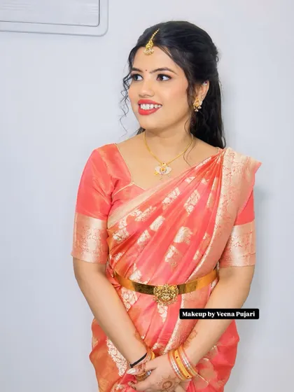 A bright and happy look. The client's smile says it all. The makeup is kept fresh and radiant to let her natural beauty shine.