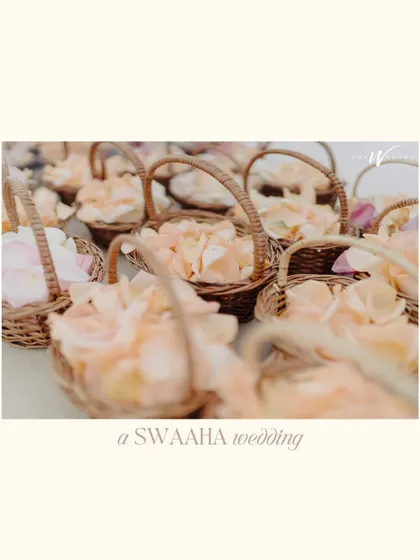 Baskets of delicate peach rose petals, ready for guests to shower the couple, a small but beautiful detail from the Dubai wedding.