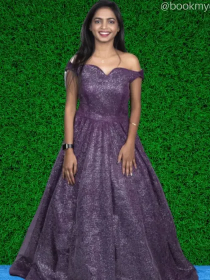 Sparkle and shine in this off-shoulder purple glitter gown. The fabric catches the light beautifully, making it a perfect choice for evening events or glam photoshoots.