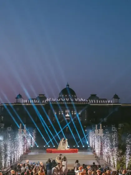 The entire palace facade becomes a canvas for light and pyrotechnics during the Varmala. My production expertise allows me to transform architectural landmarks into integral parts of the celebration.