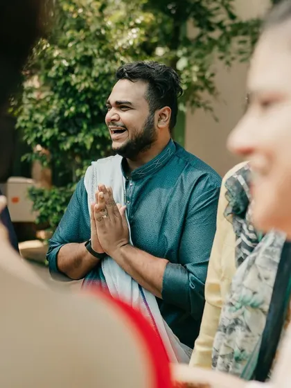A guest's reaction during the saree-draping game, a moment of pure, candid fun.