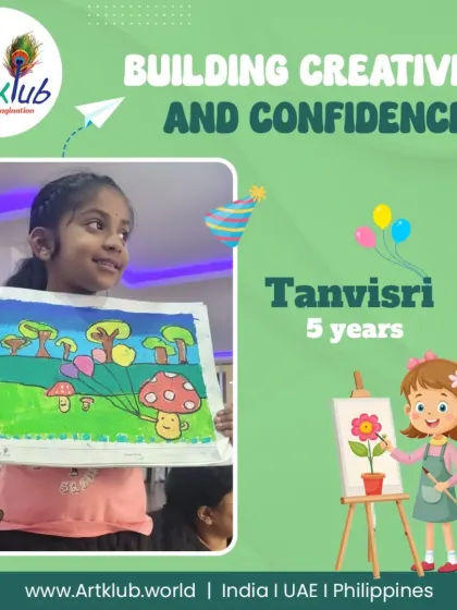 Tanvisri, age 5, beams with confidence as she holds her painting of cheerful mushrooms in a field.