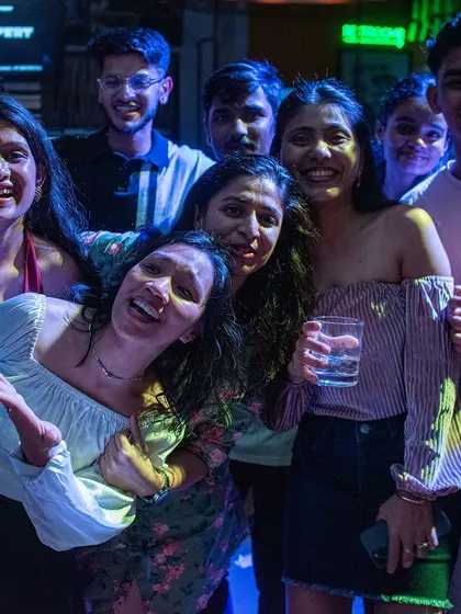 A group of friends laughing and enjoying the party at Foxtrot. The best nights are filled with laughter and good music.