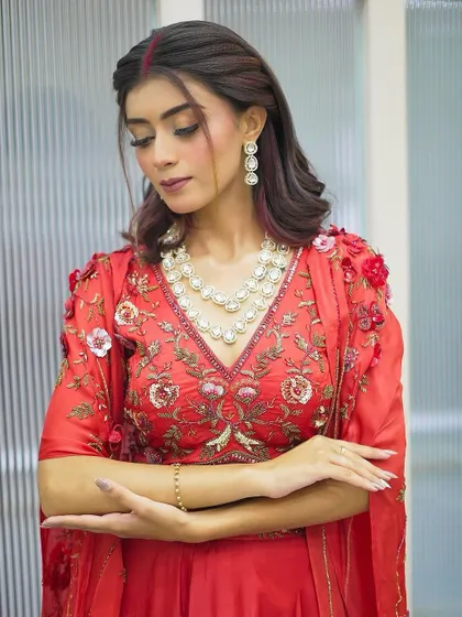 A side profile of our Karva Chauth makeup look. This angle highlights the soft contouring and the beautiful pearl necklace, showing how we consider all elements of the final look.