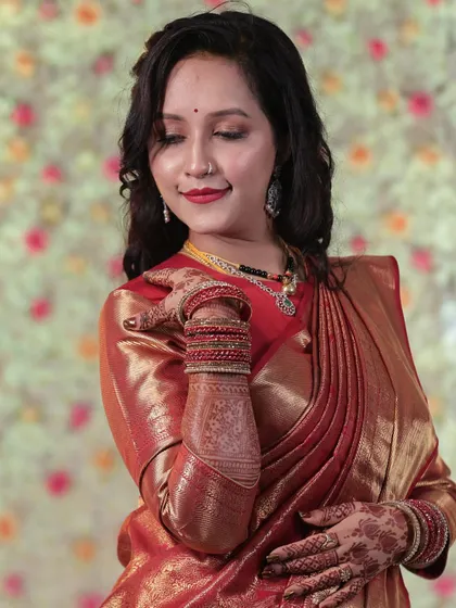 A candid moment that captures the soft, romantic feel of the makeup and hairstyle. The look is designed to be beautiful from every angle.