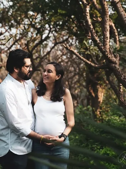 A maternity journey is a story of two people. I love capturing the shared smiles and gentle touches between partners, like this moment from an outdoor couple's pregnancy shoot, surrounded by the quiet strength of the woods.