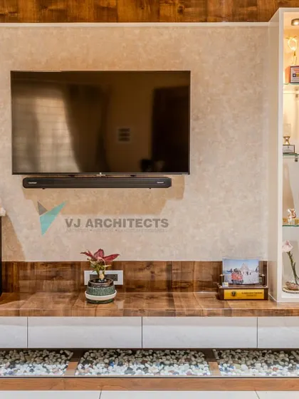 This floating media unit is a study in functional design. It combines a warm wood console with clean white drawers, a glass display case for treasured items, and a unique base filled with river stones for a natural element.