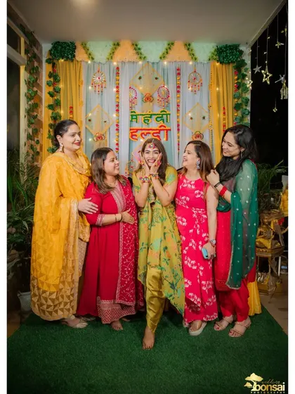 The bride posing with her friends, capturing the fun and excitement of the day.