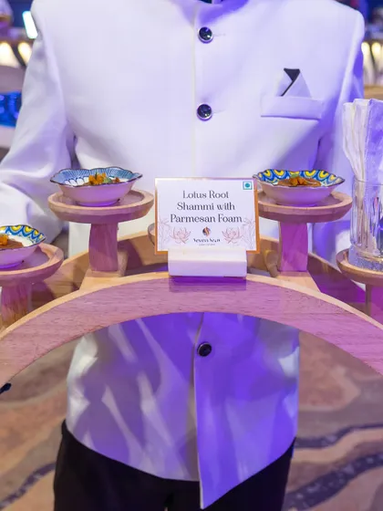 This is our signature Lotus Root Shammi with Parmesan Foam, an example of our progressive Indian culinary approach. Served with polished professionalism, it represents our commitment to innovative flavours and impeccable service.