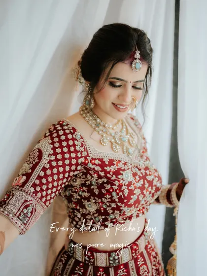 "Every detail of Richa's day was pure magic." A smiling bride, her happiness radiating through the frame, showcasing the perfection of her wedding day.