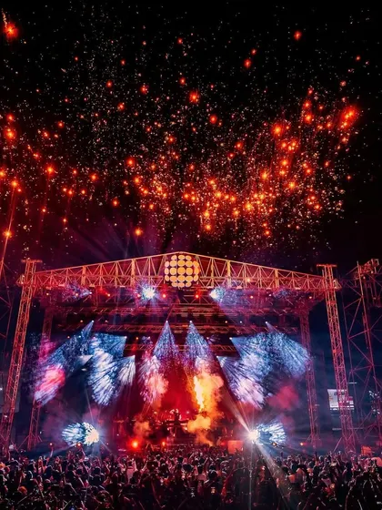 The night sky explodes with fireworks above Armin van Buuren's stage, marking the climax of an epic trance journey.