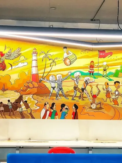 This panoramic mural was commissioned for an IT company in Mangalore's Empire Mall. It spans the length of the office, depicting a continuous narrative of coastal traditions, from Kola rituals to local beach life, bringing a piece of Mangalore's soul into a modern workspace.