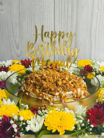 This angle shows the custom "Happy Birthday Meenal" topper on the Butterscotch Caramel Tres Leches, highlighting how I can personalize cakes for your special occasions.