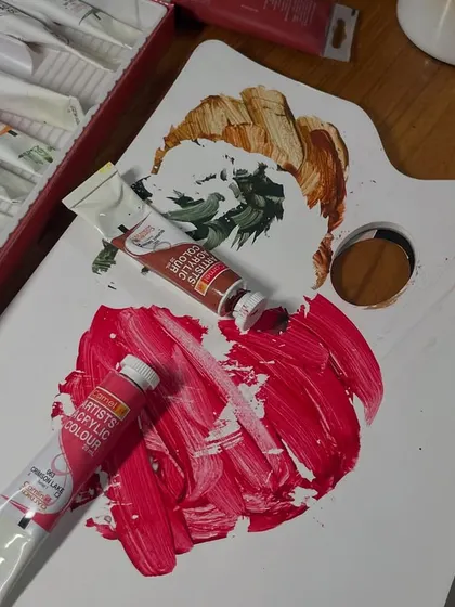 It's like a chemistry lab on my desk, trying to find the perfect red. Not too red, but red enough. You know what I mean, right?
