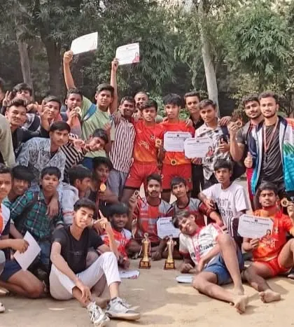 The entire team celebrating their win with certificates and trophies. The energy and happiness in this photo say it all.
