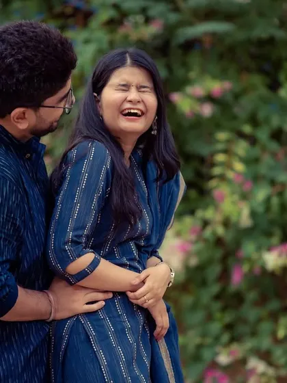 We love capturing real laughter. This candid photo from a pre-wedding shoot is full of genuine emotion and fun.