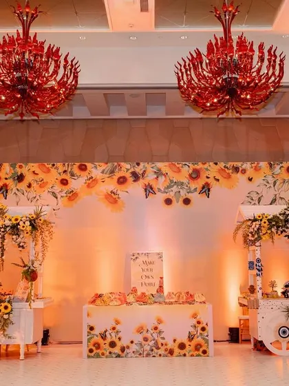 A charming decor setup at the Haldi, featuring sunflower-themed carts and backdrops. These little corners provide perfect photo opportunities for guests.