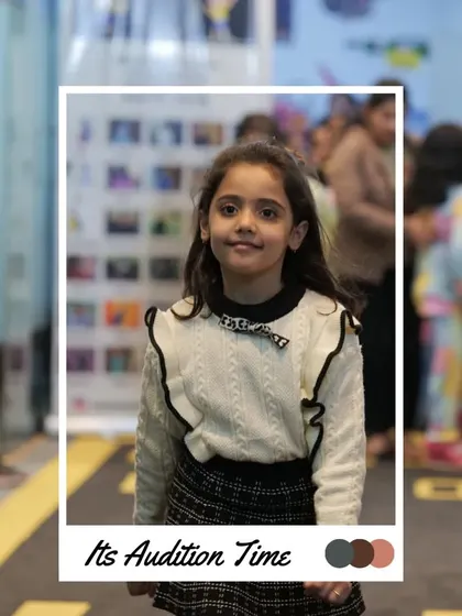 A sweet smile from this participant as she waits for her turn. The audition process is a great way to meet other kids who love fashion.