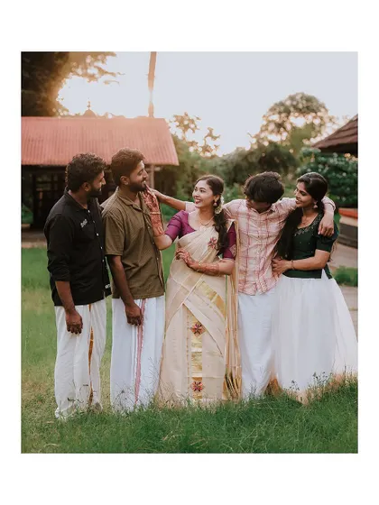 A sweet moment between the bride and her friends or siblings.