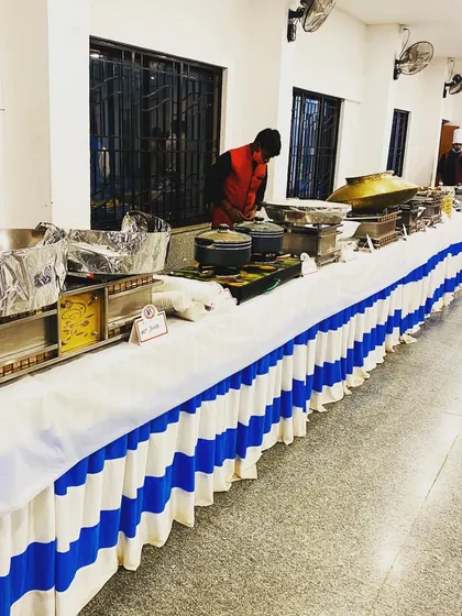This shows a standard buffet layout for an indoor corporate function or office party. The setup is clean, organized, and efficient, ensuring a hassle-free lunch or dinner service.