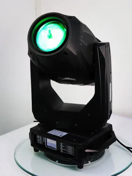 A studio shot of the 380W 3-in-1 moving head, showing its green output. The color mixing on these units is seamless, allowing for a huge range of vibrant hues.
