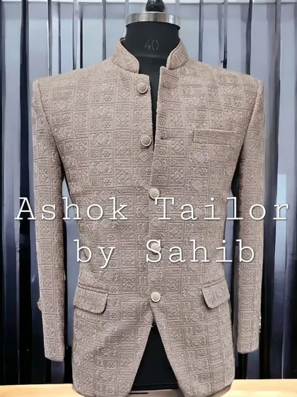 A Jodhpuri jacket in a textured brown fabric. The subtle self-design gives it a sophisticated look, perfect for formal and semi-formal events.