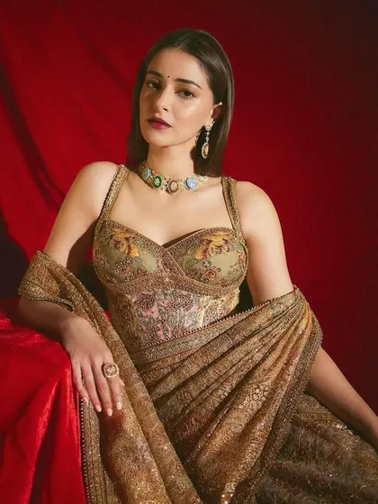 Ananya Panday in a regal pose, wearing my handcrafted Navratna concept choker and earrings. The vintage inspired micromosaic set was created to complement her archival Ritu Kumar couture look.