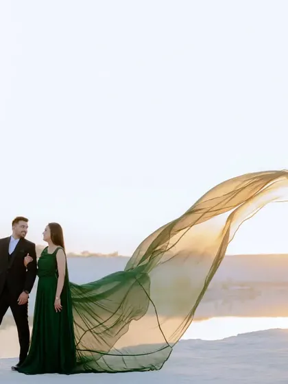 This wide-angle shot shows the scale of the landscape and the beauty of the flowing gown. It’s a great example of the epic, cinematic style I bring to my pre-wedding photography.
