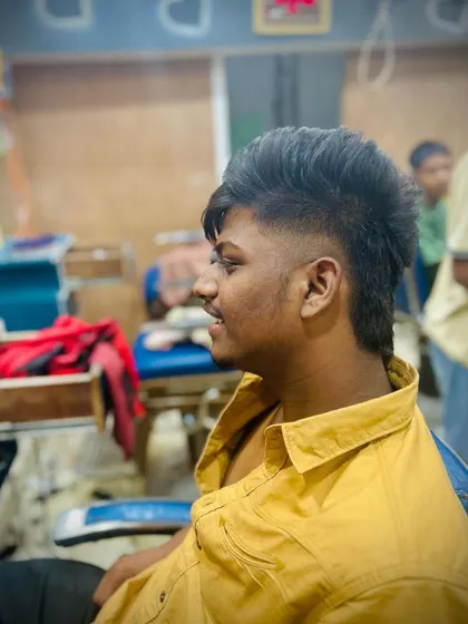 A side view of the choppy-textured mullet, highlighting the contrast between the faded sides and the longer sections.
