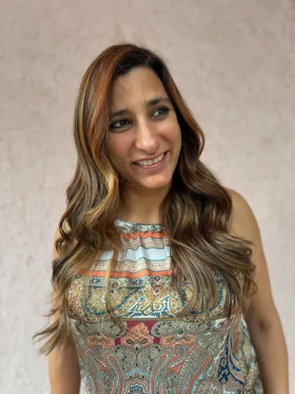 A happy client showing off her color correction. We used non-bleach color to create these sunlit threads of brunette brilliance. (No filter)