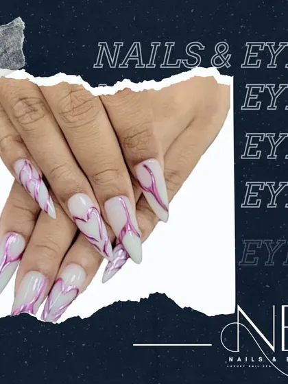 A promotional image featuring our dramatic, long stiletto nails with an abstract heart line design.