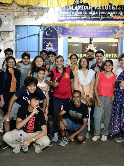 A large group of guests posing for a photo after their meal. It's always a pleasure to host big parties.