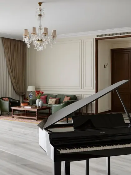 A film production office feels incomplete without music. Placing a baby grand piano in the heart of this lounge was an instinctive choice to make the space feel more like a home. It serves as a beautiful visual statement and a source of spontaneous creativity for jam sessions or quiet moments.