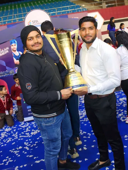Holding the SFA Championship trophy. A proud moment representing our success in both Kho-Kho and Kabaddi.