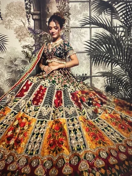 I love helping my clients stand out with unique pieces. This multi-colored panelled lehenga is perfectly complemented by a detailed choker and matching earrings, making it an ideal choice for a vibrant sangeet or mehendi function.