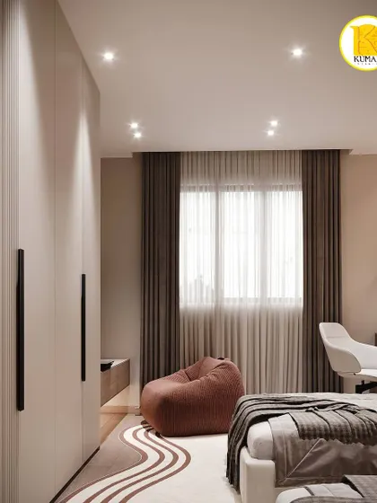 This view shows the fluted wardrobe doors and the soft, flowing rug that adds texture and comfort to the bedroom.