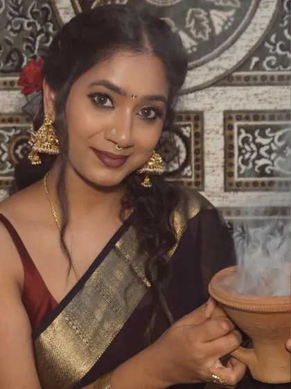 So in love with this aesthetic vintage shoot. Here I am in a classic black saree with a gold border and a simple red blouse, holding a traditional dhunuchi for a smoky, dramatic effect.