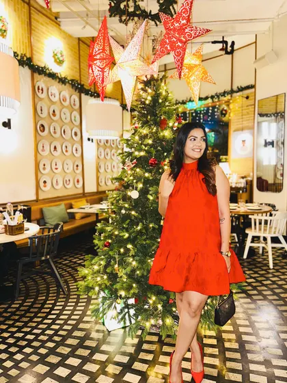 A final shot of my festive red outfit, ready for a night of celebration.